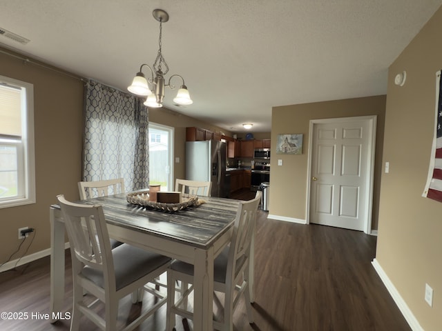 141 Jessie Cir, Hubert, NC 28539 - dining room featuring a chandelier and dark wood finished floors