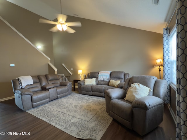 141 Jessie Cir, Hubert, NC 28539 - living area featuring dark wood-type flooring, a ceiling fan, lofted ceiling, and stairway