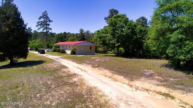 2023 NC-211 Hwy, Eagle Springs, NC 27242 - view of dirt / gravel road with a view of trees