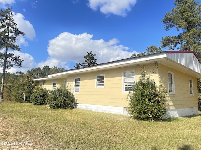 2023 NC-211 Hwy, Eagle Springs, NC 27242 - view of home's exterior featuring a yard and crawl space