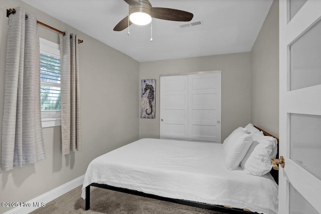 323 Cape Fear Blvd, Wilmington, NC 28401 - bedroom with baseboards, ceiling fan, and carpet floors
