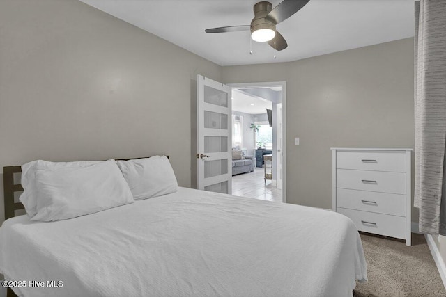 323 Cape Fear Blvd, Wilmington, NC 28401 - bedroom with a ceiling fan, light carpet, and baseboards