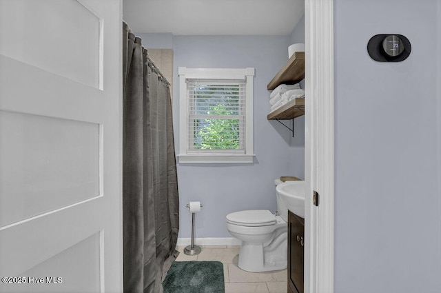 323 Cape Fear Blvd, Wilmington, NC 28401 - full bathroom featuring toilet, tile patterned floors, vanity, a shower with shower curtain, and baseboards
