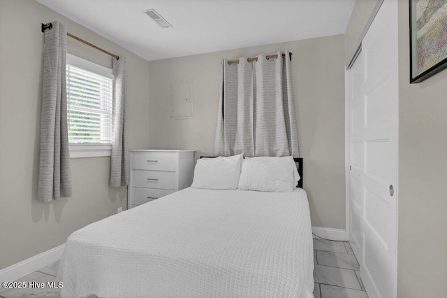 323 Cape Fear Blvd, Wilmington, NC 28401 - bedroom with baseboards and light marble finish flooring
