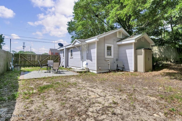 323 Cape Fear Blvd, Wilmington, NC 28401 - back of property featuring a patio area and a fenced backyard