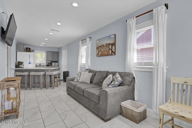 323 Cape Fear Blvd, Wilmington, NC 28401 - living area with recessed lighting and light marble finish flooring