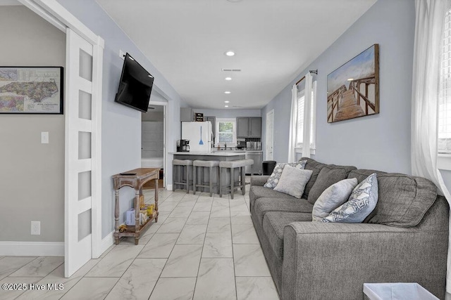 323 Cape Fear Blvd, Wilmington, NC 28401 - living area featuring light marble finish floors and recessed lighting