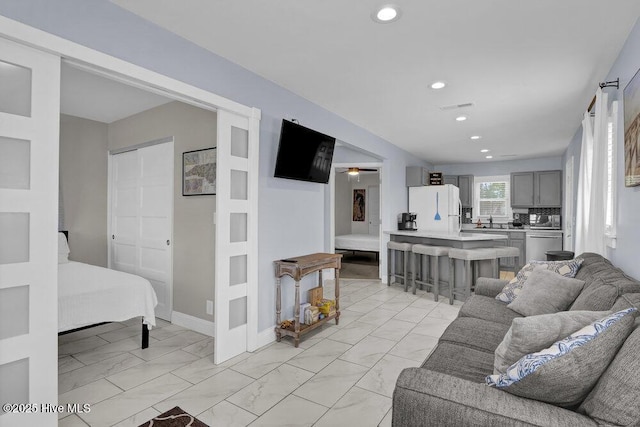323 Cape Fear Blvd, Wilmington, NC 28401 - living room with light marble finish flooring, recessed lighting, and a ceiling fan