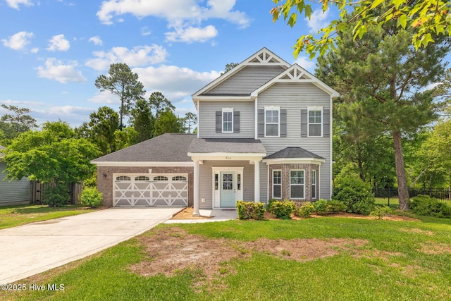266 Marsh Haven Dr, Sneads Ferry, NC 28460 - view of front of house with a garage, driveway, and roof with shingles