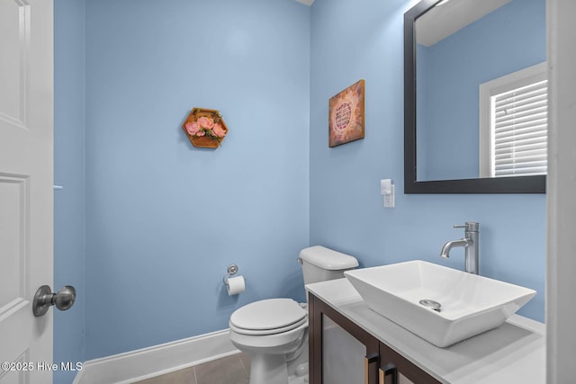 266 Marsh Haven Dr, Sneads Ferry, NC 28460 - half bathroom featuring tile patterned floors, toilet, baseboards, and vanity