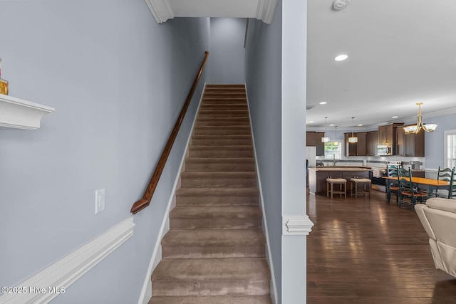 266 Marsh Haven Dr, Sneads Ferry, NC 28460 - staircase with wood finished floors, recessed lighting, crown molding, and a chandelier