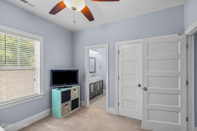 266 Marsh Haven Dr, Sneads Ferry, NC 28460 - unfurnished bedroom featuring light colored carpet, baseboards, connected bathroom, and a closet