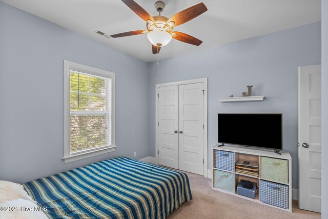 266 Marsh Haven Dr, Sneads Ferry, NC 28460 - bedroom with carpet, a closet, and a ceiling fan