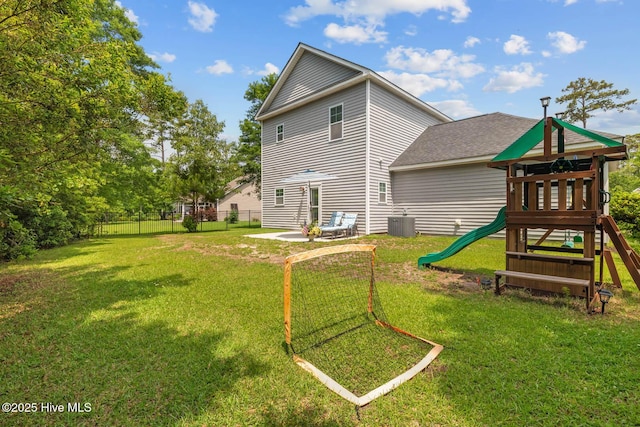 266 Marsh Haven Dr, Sneads Ferry, NC 28460 - rear view of property with a playground, a shingled roof, and central air condition unit