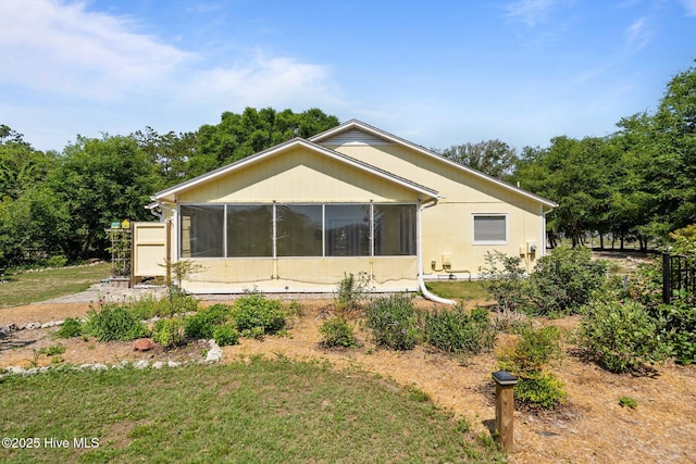 120 NW 19th St, Oak Island, NC 28465 - back of property featuring a sunroom