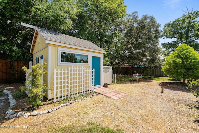 120 NW 19th St, Oak Island, NC 28465 - fenced backyard featuring an outdoor structure