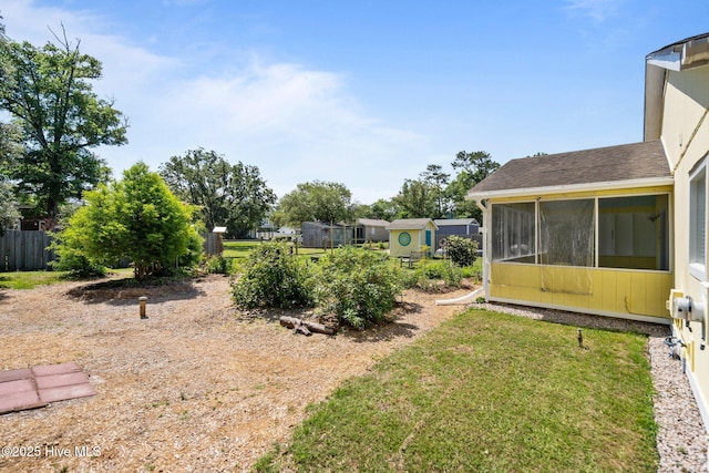 120 NW 19th St, Oak Island, NC 28465 - view of yard featuring a sunroom