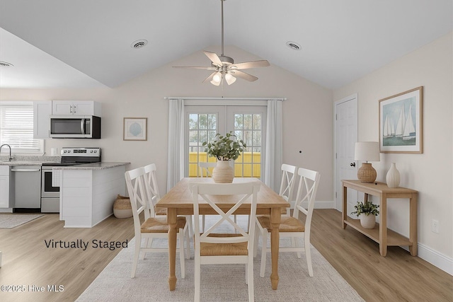 120 NW 19th St, Oak Island, NC 28465 - dining space with light wood-type flooring, ceiling fan, and lofted ceiling