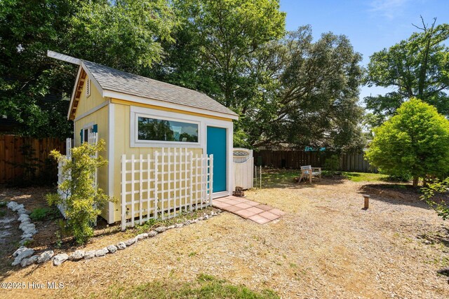 120 NW 19th St, Oak Island, NC 28465 - fenced backyard featuring an outbuilding