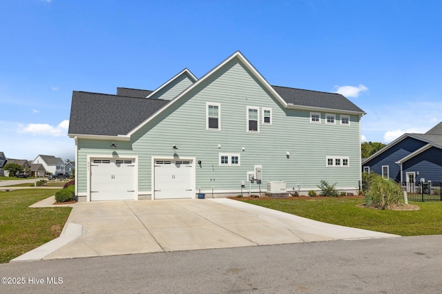 601 Trawler Pl, Newport, NC 28570 - view of side of property featuring driveway, a yard, and a shingled roof