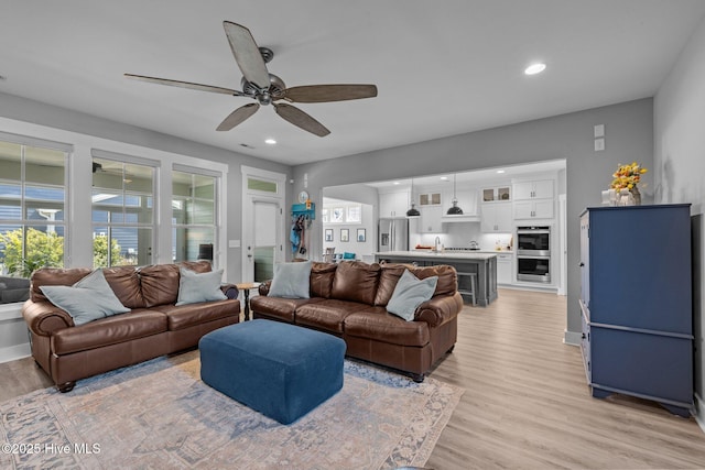 601 Trawler Pl, Newport, NC 28570 - living room with light wood-style floors, recessed lighting, a ceiling fan, and baseboards