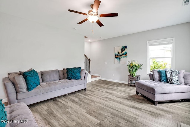 2610 Longleaf Pine Cir, Leland, NC 28451 - living area with stairs, light wood finished floors, baseboards, a ceiling fan, and recessed lighting