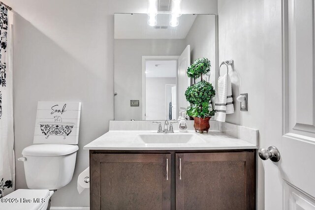 2610 Longleaf Pine Cir, Leland, NC 28451 - bathroom with vanity and toilet