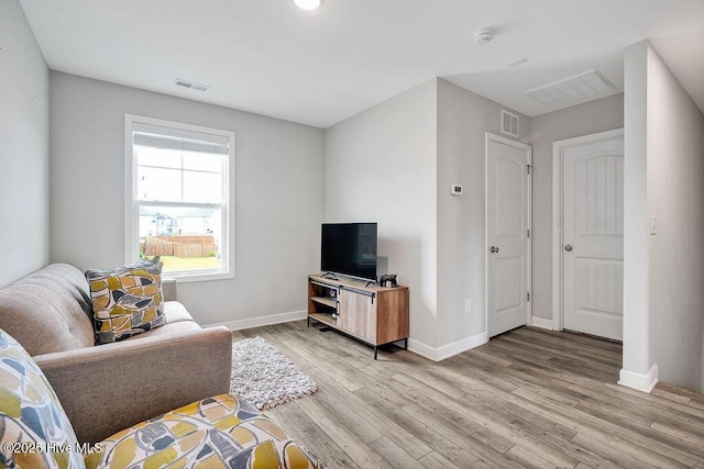 2610 Longleaf Pine Cir, Leland, NC 28451 - living area with light wood-type flooring and baseboards