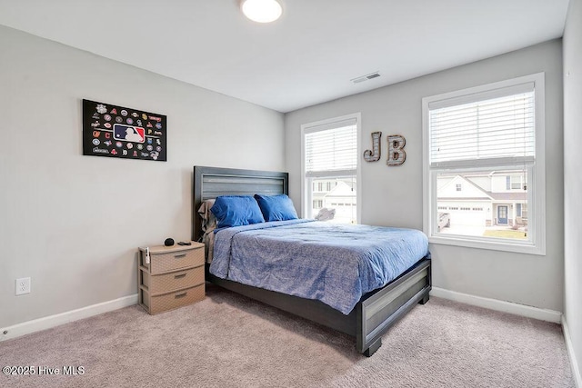2610 Longleaf Pine Cir, Leland, NC 28451 - bedroom with baseboards and light carpet