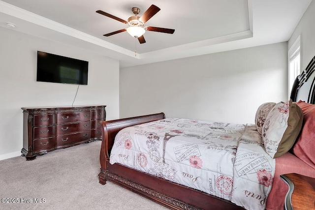 2610 Longleaf Pine Cir, Leland, NC 28451 - bedroom with a tray ceiling, carpet, and a ceiling fan