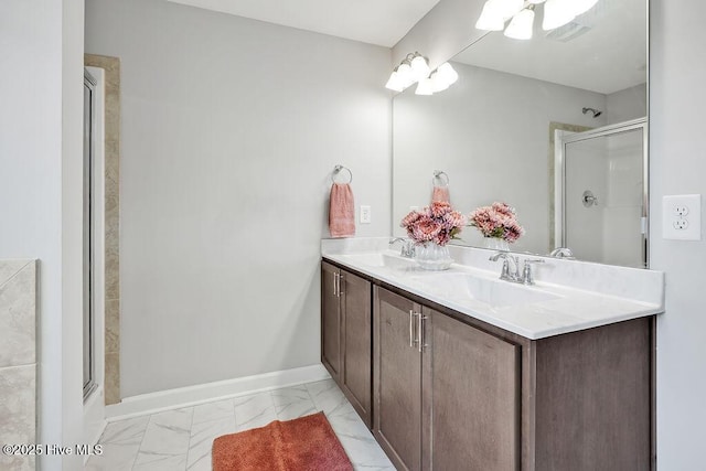 2610 Longleaf Pine Cir, Leland, NC 28451 - bathroom featuring marble look tile flooring, a stall shower, double vanity, and baseboards