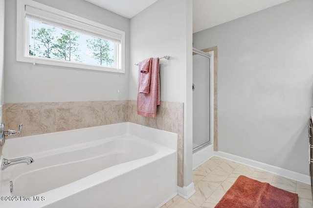 2610 Longleaf Pine Cir, Leland, NC 28451 - bathroom featuring a shower stall, a bath, and marble finish flooring