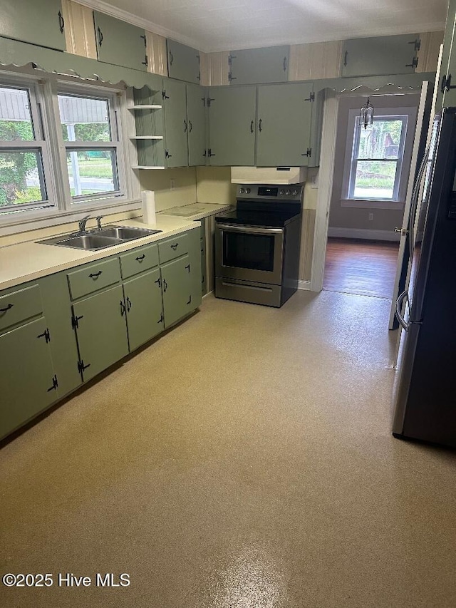 302 N Main St, Robersonville, NC 27871 - kitchen featuring stainless steel electric range, freestanding refrigerator, green cabinets, and a sink