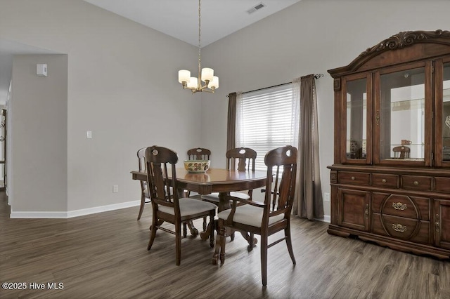 7475 Thais Trl, Wilmington, NC 28411 - dining area with dark wood-style floors, a chandelier, and baseboards