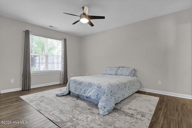 7475 Thais Trl, Wilmington, NC 28411 - bedroom featuring wood finished floors, baseboards, and a ceiling fan