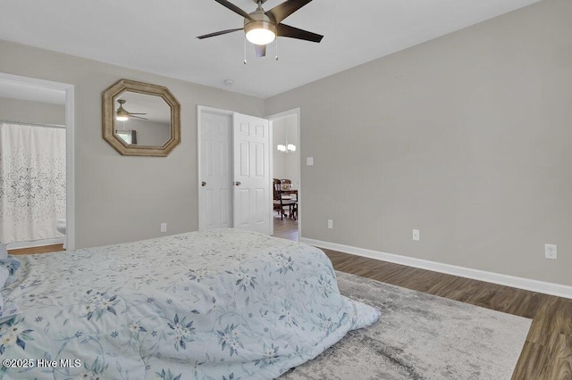 7475 Thais Trl, Wilmington, NC 28411 - bedroom with wood finished floors, baseboards, ensuite bathroom, and a ceiling fan