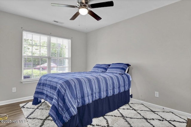 7475 Thais Trl, Wilmington, NC 28411 - bedroom featuring baseboards, a ceiling fan, and wood finished floors