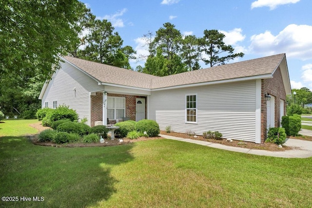 7475 Thais Trl, Wilmington, NC 28411 - single story home featuring brick siding, a front yard, and roof with shingles