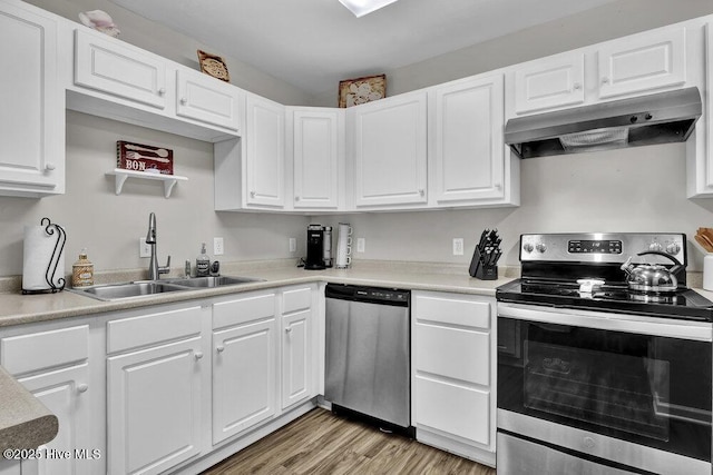 7475 Thais Trl, Wilmington, NC 28411 - kitchen with appliances with stainless steel finishes, under cabinet range hood, a sink, and white cabinets