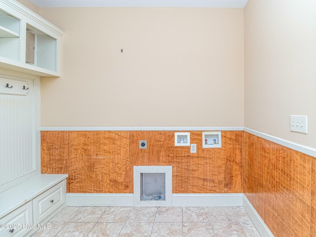 laundry room with electric dryer hookup, hookup for a washing machine, and wainscoting