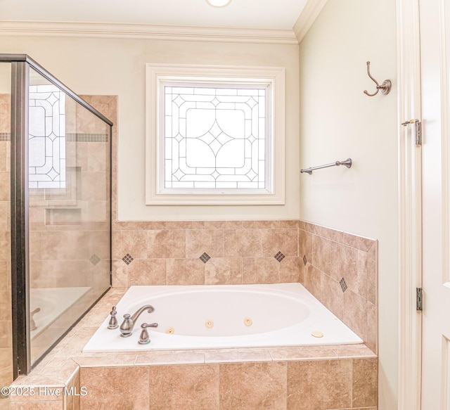 full bathroom with a tub with jets, a stall shower, and ornamental molding
