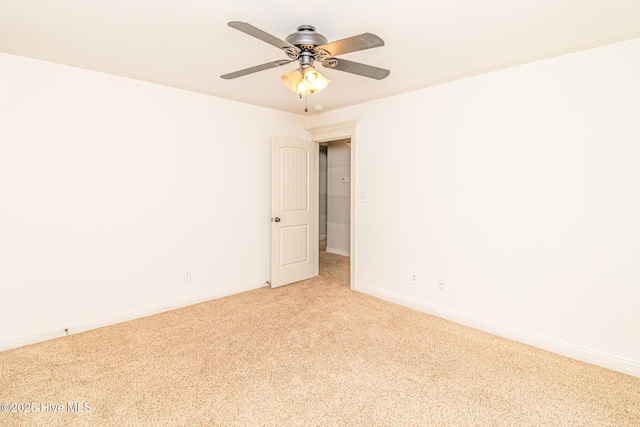 unfurnished room with light carpet, a ceiling fan, and baseboards
