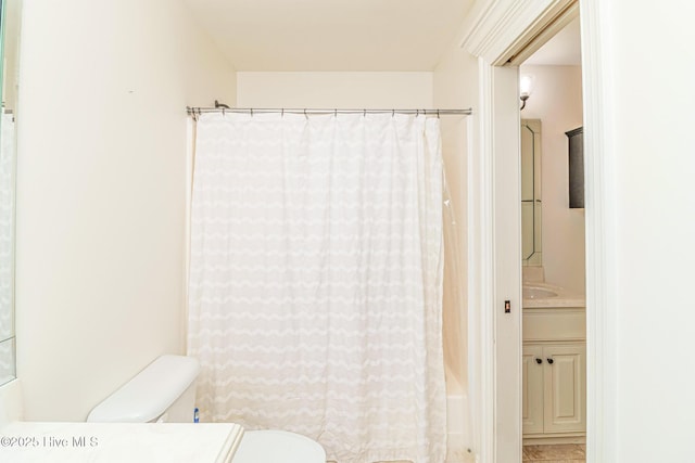 full bath featuring vanity and toilet