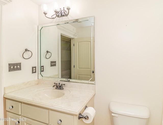 bathroom with toilet and vanity