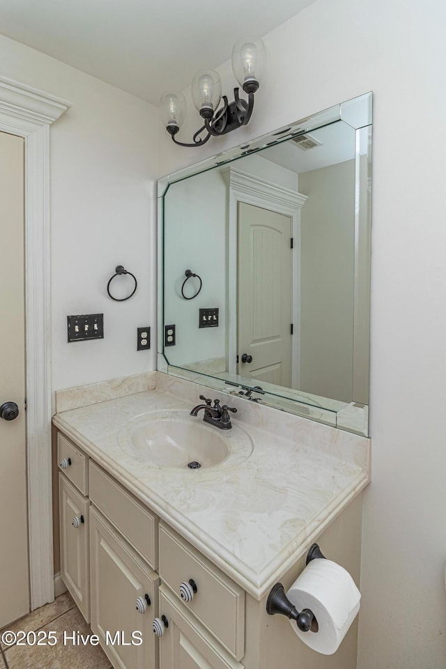 bathroom with vanity and tile patterned floors
