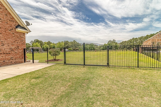 view of yard with a gate