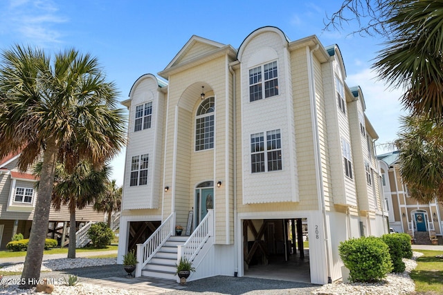 208 Sea Manor Dr, Surf City, NC 28445 - coastal home with a carport and driveway