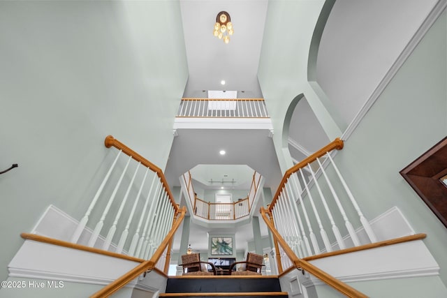 208 Sea Manor Dr, Surf City, NC 28445 - staircase featuring a towering ceiling and recessed lighting
