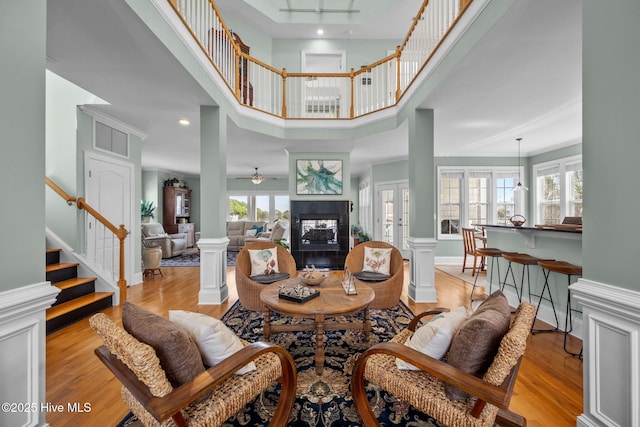 208 Sea Manor Dr, Surf City, NC 28445 - living room with stairs, a ceiling fan, light wood-type flooring, a multi sided fireplace, and recessed lighting