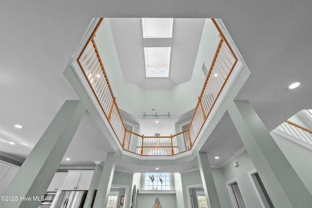 208 Sea Manor Dr, Surf City, NC 28445 - detailed view of recessed lighting, ornamental molding, and refrigerator